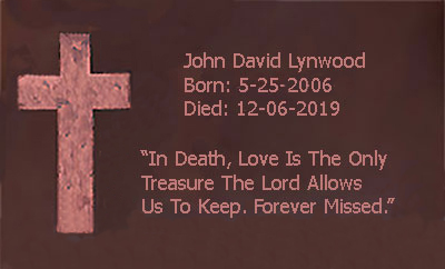 Copper memorial plaque with cross and a message