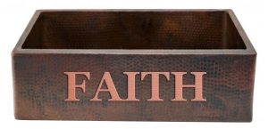 copper kitchen apron sink with the saying faith on it