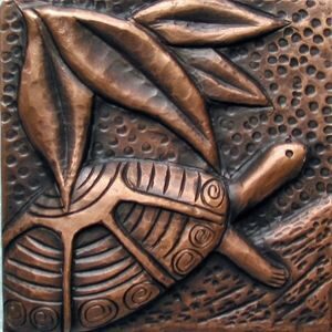 copper tile with turtle design