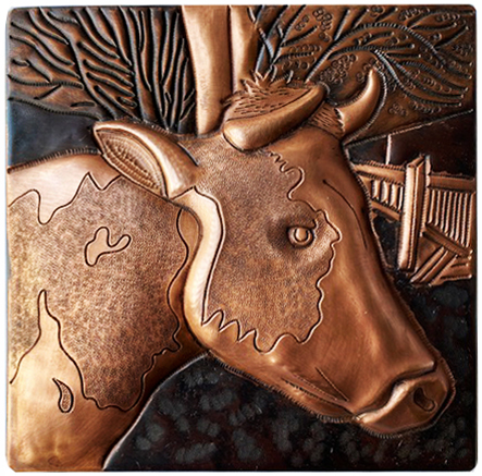 Copper tile with cow design