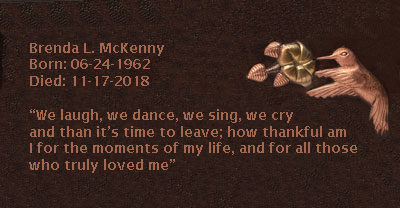 Copper memorial plaque with humming bird and message